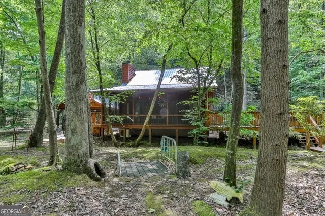 a backyard of a house with lots of green space