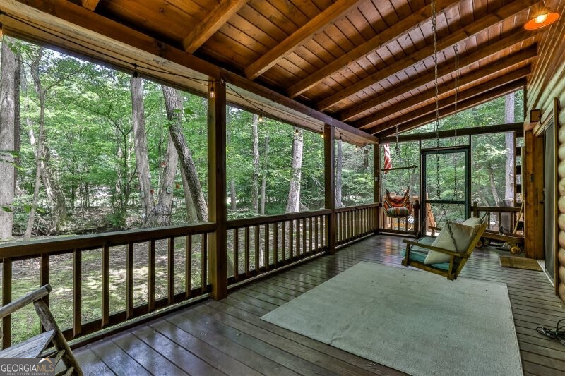 420 Olivers Trail Cherry Log, GA 30522 - Photo 21 of 27 a balcony with wooden furniture and roof