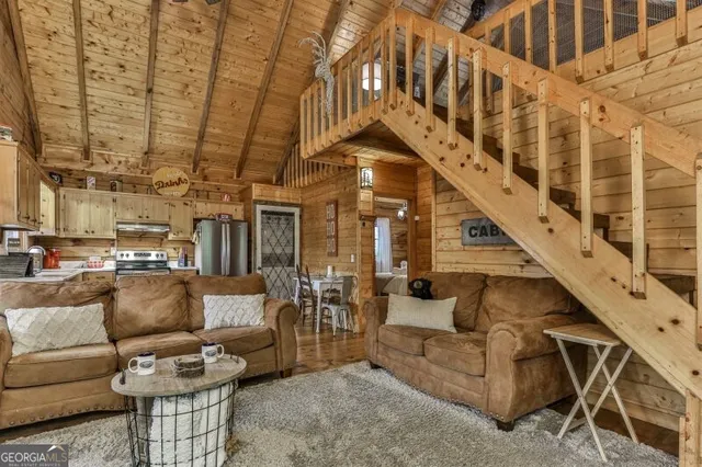 a view of entryway and hall with couches