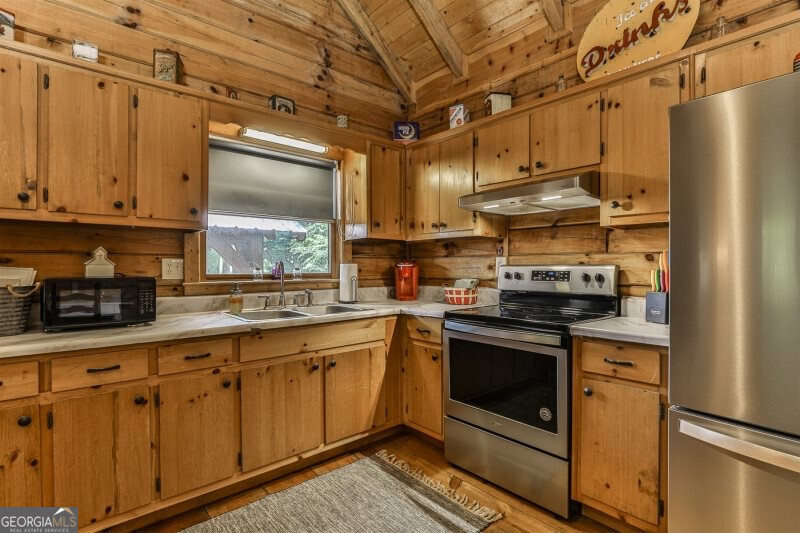 420 Olivers Trail Cherry Log, GA 30522 - Photo 8 of 27 a kitchen with stainless steel appliances granite countertop a stove a sink and white cabinets