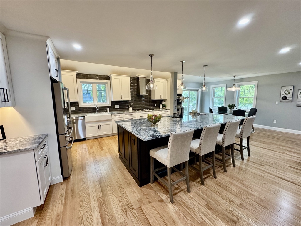 21 McCullough Road Saugus, MA 01906 - Photo 12 of 41 a large kitchen with a table and chairs
