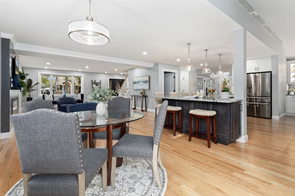 21 McCullough Road Saugus, MA 01906 - Photo 13 of 41 a living room with furniture a chandelier and kitchen view