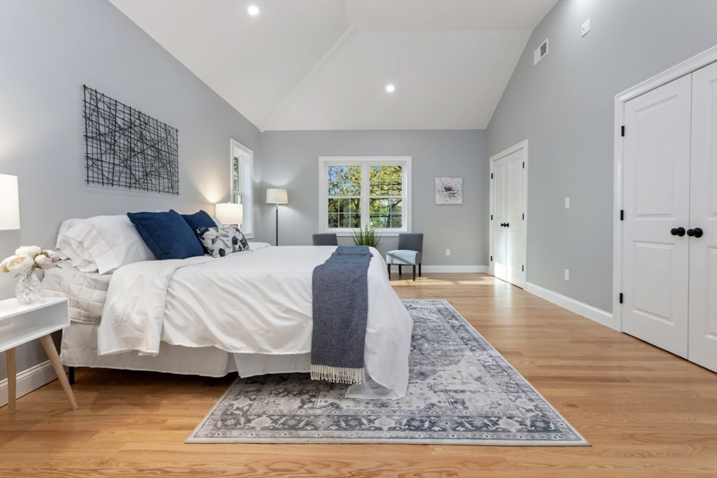 21 McCullough Road Saugus, MA 01906 - Photo 23 of 41 a spacious bedroom with a bed a rug and a window
