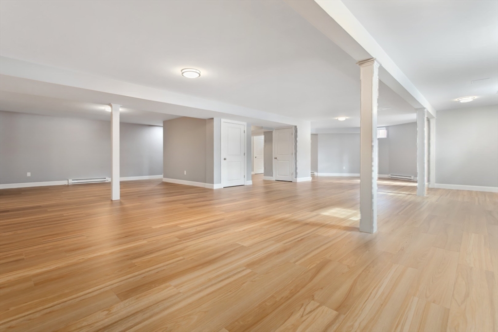 21 McCullough Road Saugus, MA 01906 - Photo 31 of 41 a view of an empty room with wooden floor