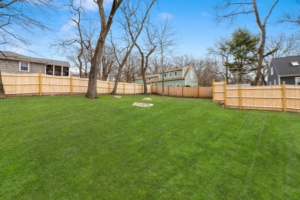 21 McCullough Road Saugus, MA 01906 - Photo 35 of 41 a view of a yard with a house in the background