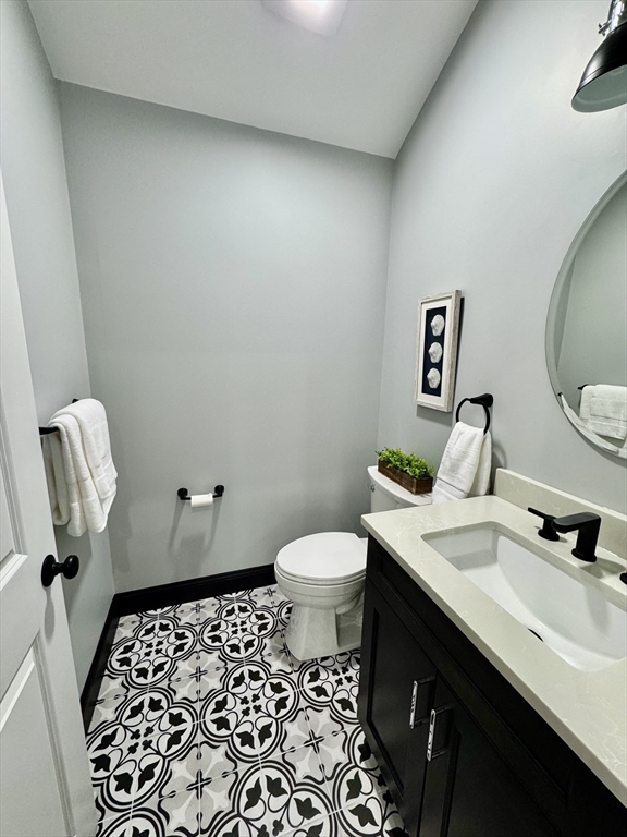 21 McCullough Road Saugus, MA 01906 - Photo 5 of 41 a bathroom with a sink toilet and shower