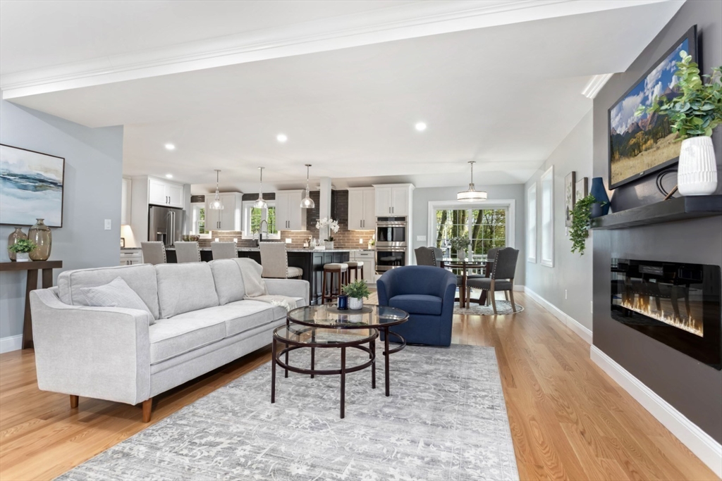 21 McCullough Road Saugus, MA 01906 - Photo 8 of 41 a living room with furniture wooden floor and a fireplace