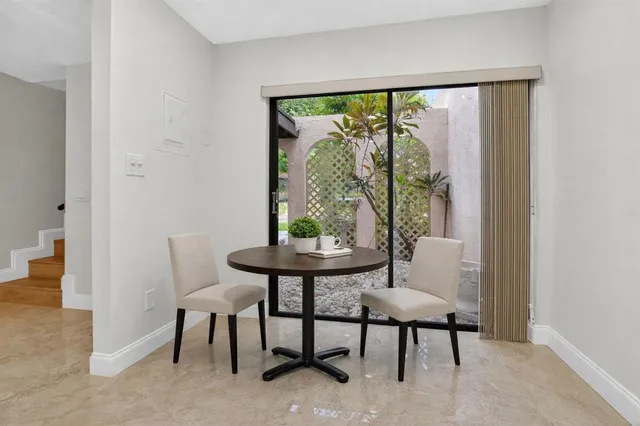 wooden floor in a room with a large window