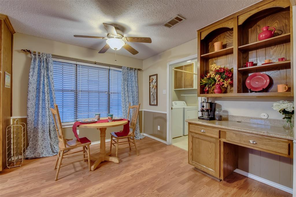 5718 Sagebrush Trail Arlington, TX 76017 - Photo 14 of 26 a view of a dining room with furniture and chandelier