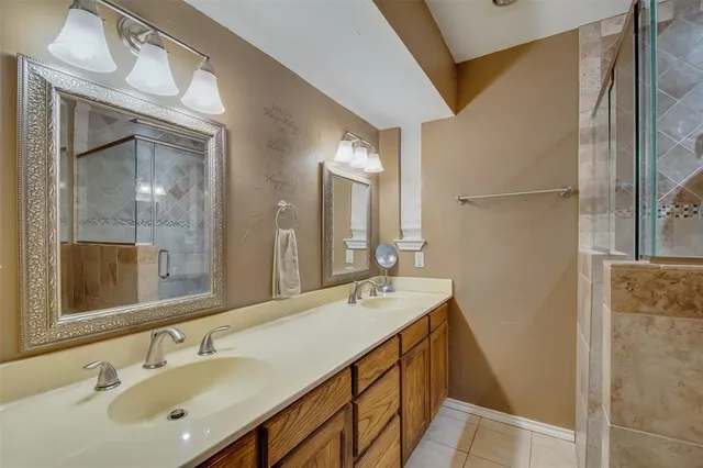 a bathroom with a double vanity sink mirror and double