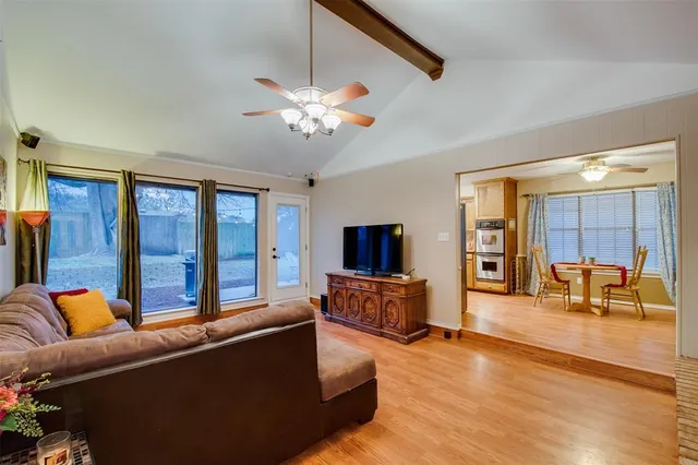 a living room with furniture fireplace and a flat screen tv