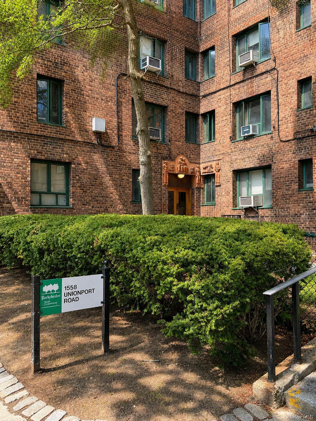 1558 Unionport Road, Unit 2D Bronx, NY 10462 - Photo 8 of 9 a view of a brick building with many windows