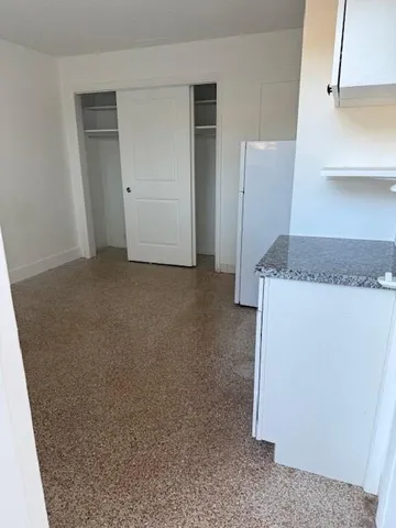 a view of a kitchen cabinets