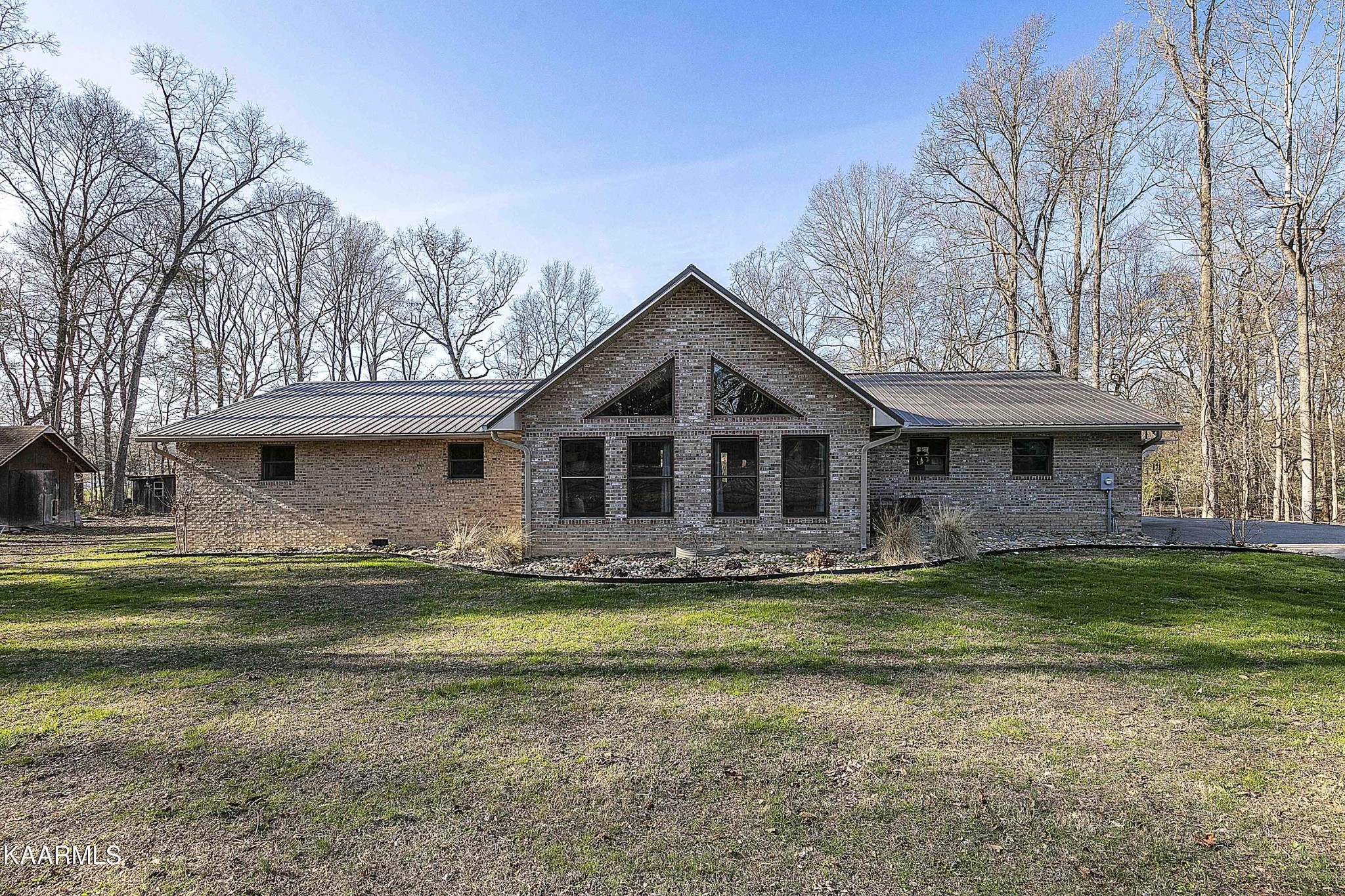 1434 Cunningham Road West Seymour, TN 37865 - Photo 1 of 31 a front view of a house with a garden