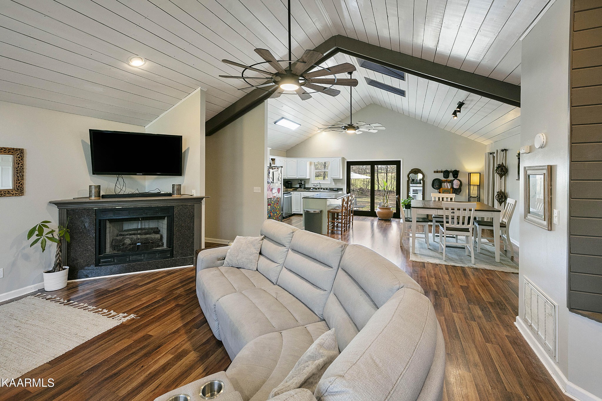 1434 Cunningham Road West Seymour, TN 37865 - Photo 5 of 31 a living room with furniture a flat screen tv and a fireplace