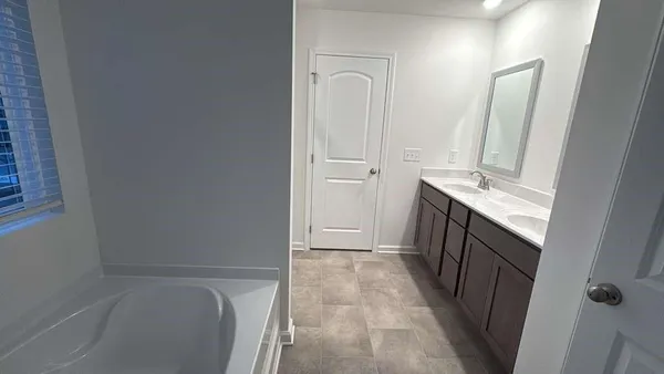 a bathroom with a sink a toilet and vanity