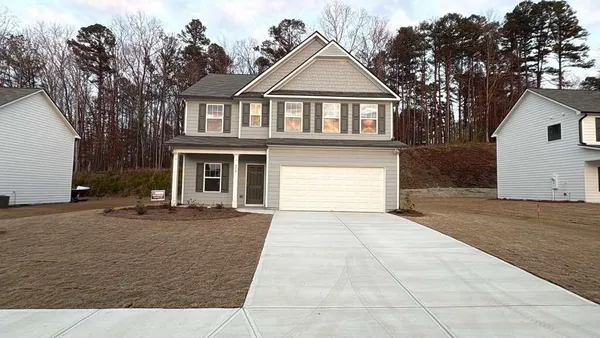 front view of a house with a street