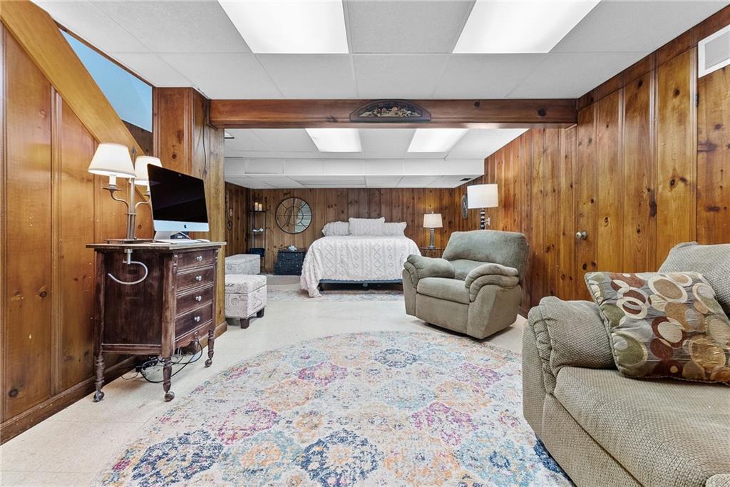 466 Haverhill Road Pittsburgh, PA 15228 - Photo 27 of 41 a living room with furniture and a flat screen tv