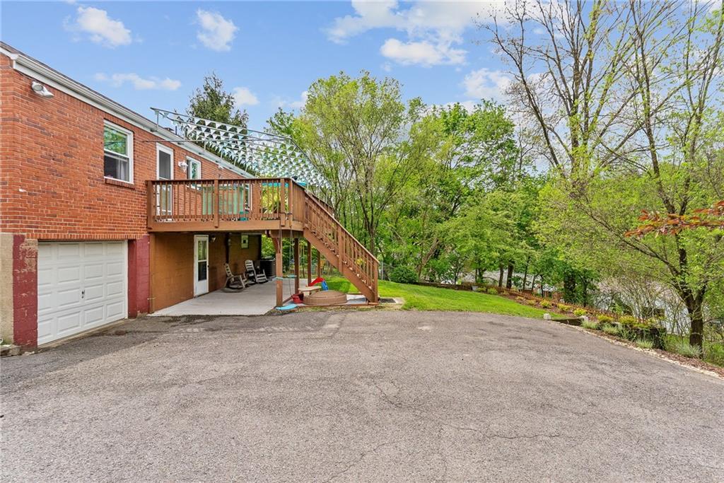 466 Haverhill Road Pittsburgh, PA 15228 - Photo 34 of 41 a view of an house with backyard and a tree