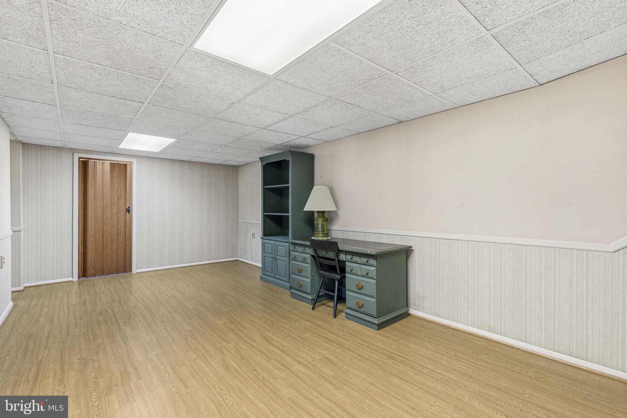 3001 Merrymans Mill Road Phoenix, MD 21131 - Photo 20 of 46 a view of empty room with wooden floor and fan