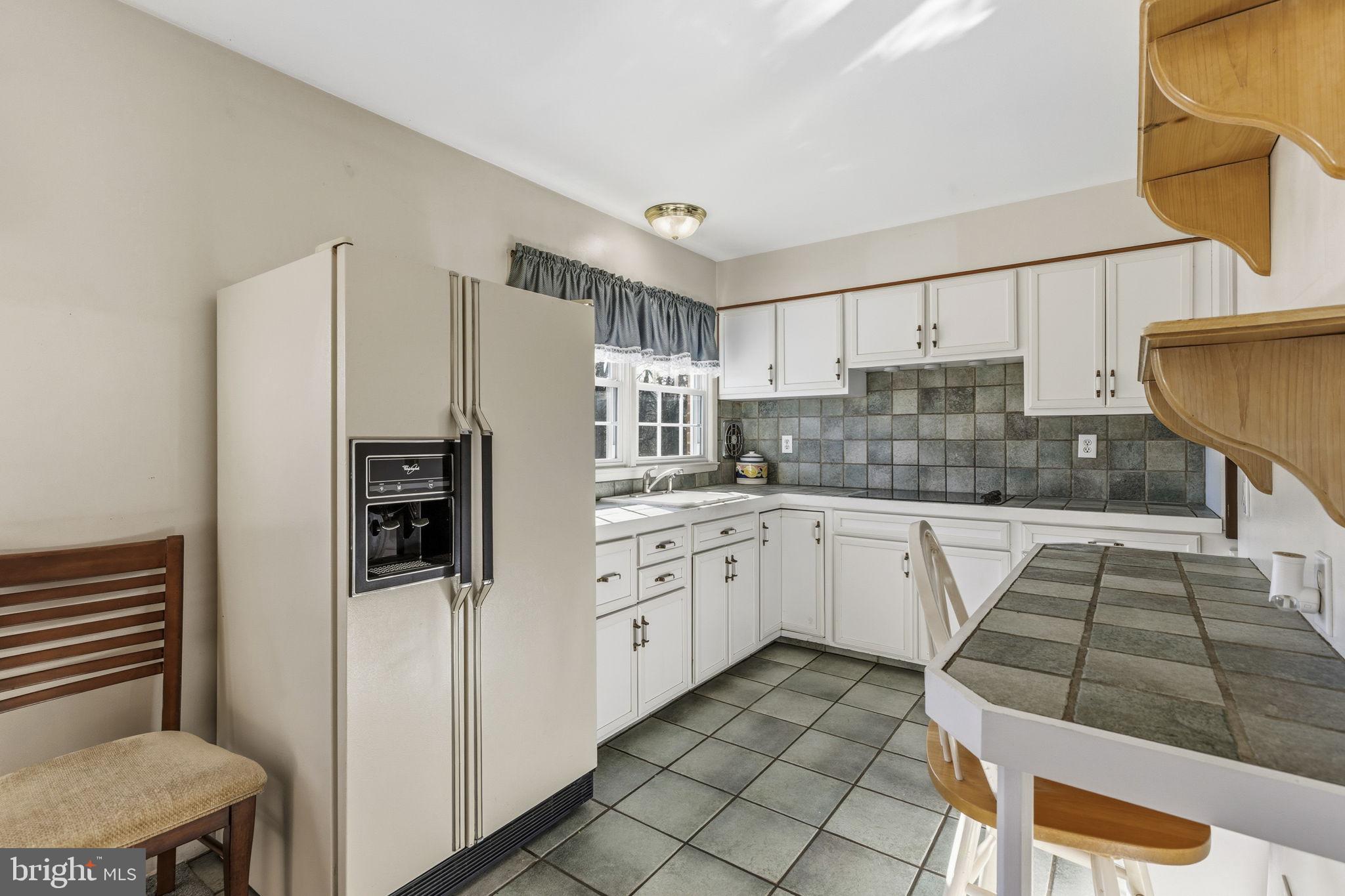 3001 Merrymans Mill Road Phoenix, MD 21131 - Photo 8 of 46 a kitchen with stainless steel appliances granite countertop a refrigerator and a stove top oven