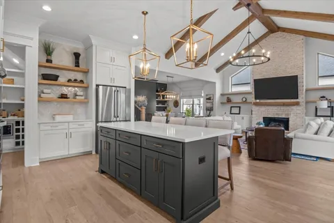 a living room with furniture and a ceiling fan