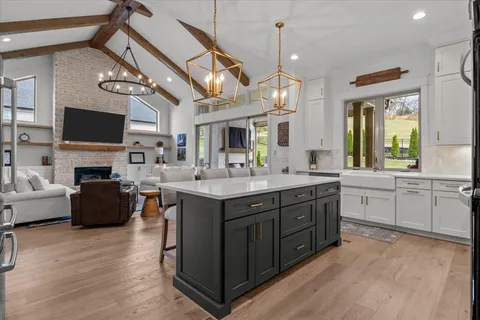 a table with a stove and a painting on the wall