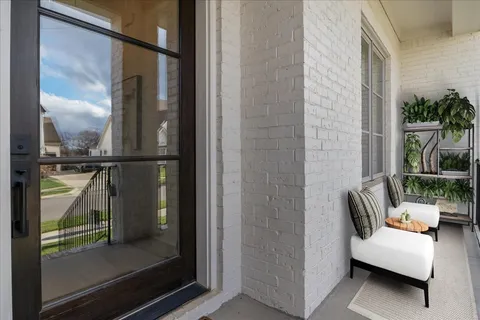 a view of a dining room with furniture and window