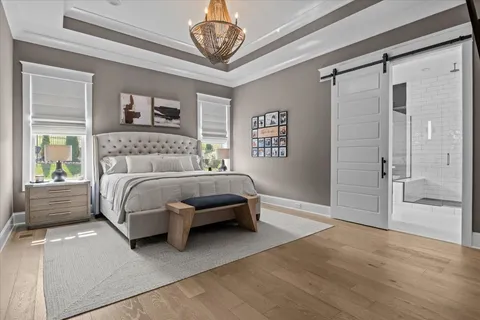 a spacious bathroom with a granite countertop sink and a mirror