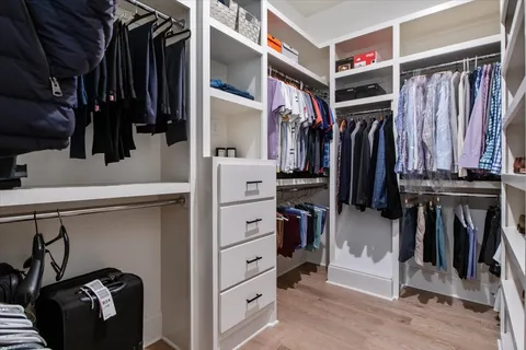 a living room with furniture and a ceiling fan