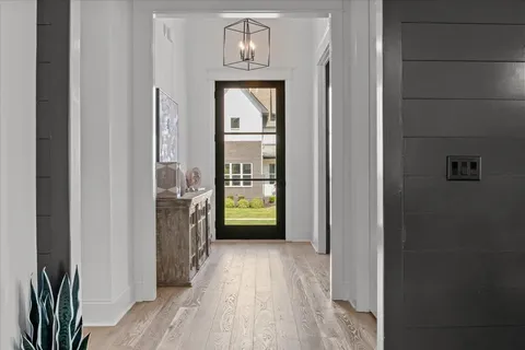 a large kitchen with a table and chairs