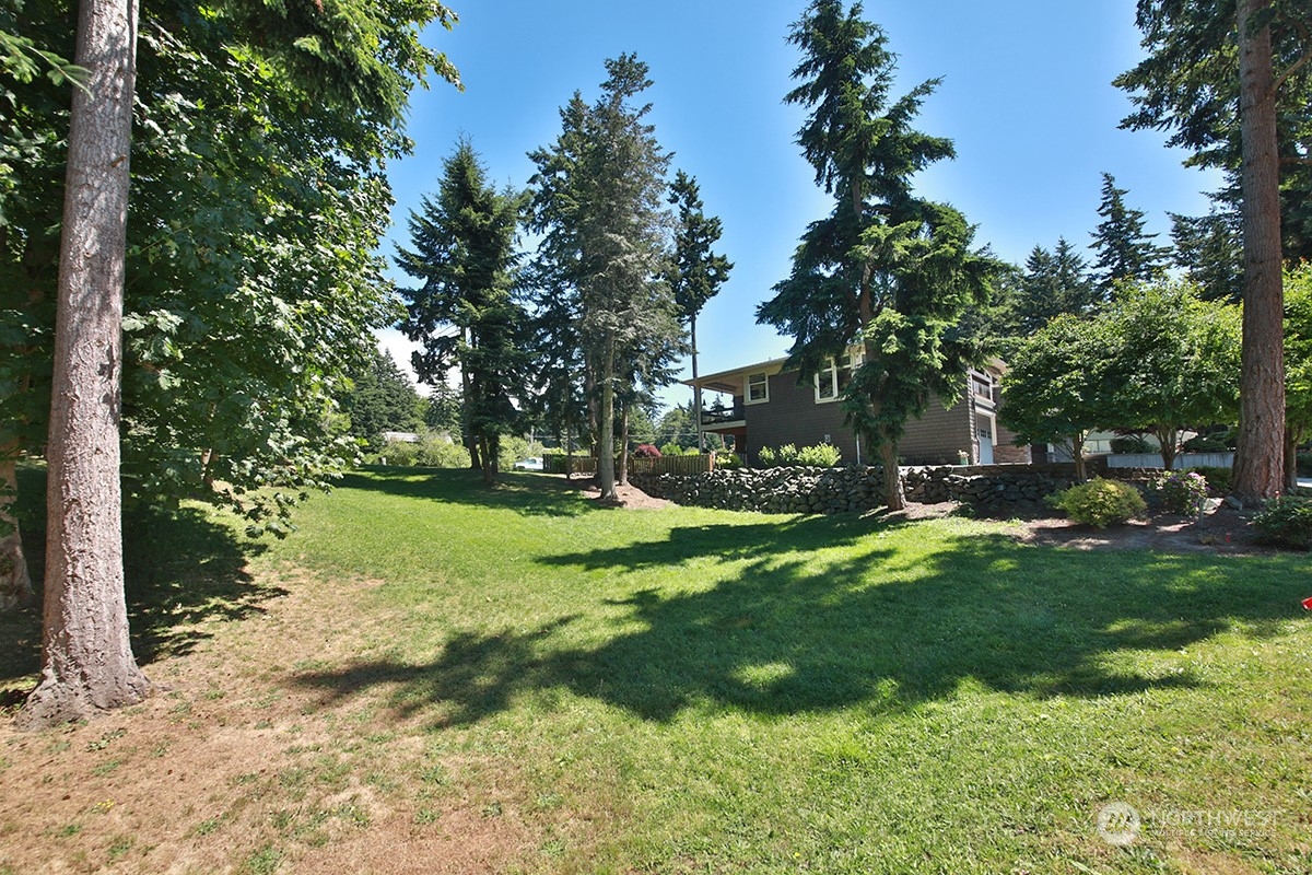 6329 Sahalee Court Clinton, WA 98236 - Photo 1 of 36 a view of a park with large trees