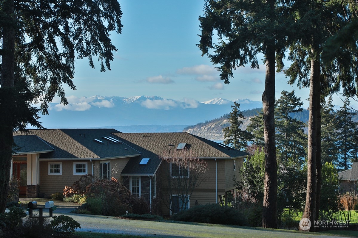 6329 Sahalee Court Clinton, WA 98236 - Photo 18 of 36 front view of a house with a tree
