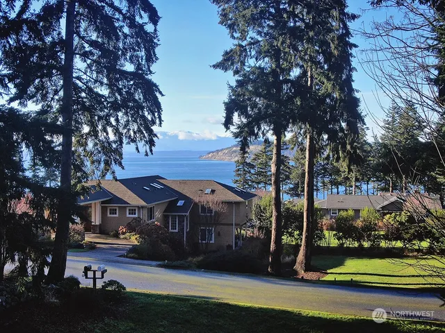 a view of house with yard in front of it