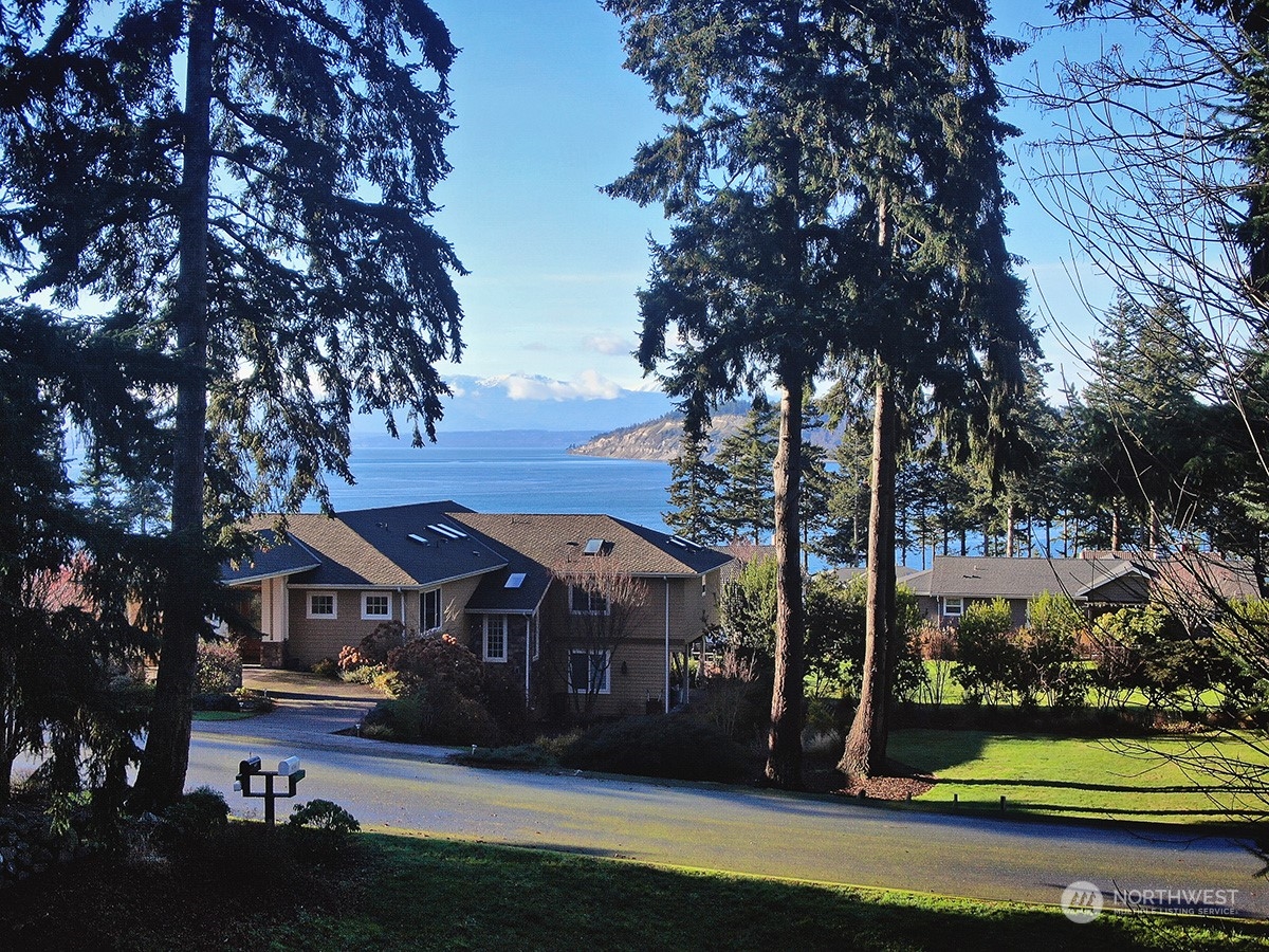 6329 Sahalee Court Clinton, WA 98236 - Photo 21 of 36 a view of house with yard in front of it