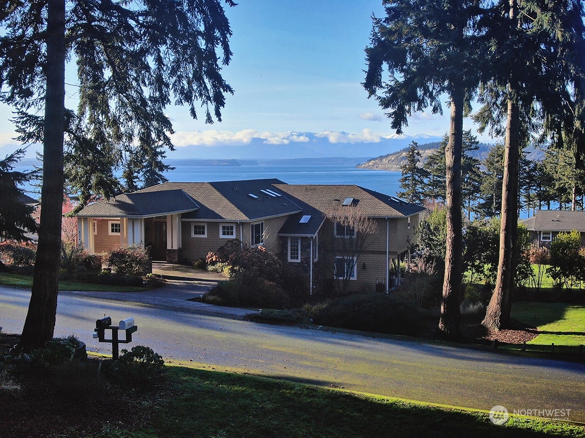6329 Sahalee Court Clinton, WA 98236 - Photo 22 of 36 a view of house with yard in front of it
