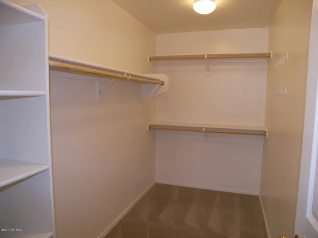 a view of an empty walk in closet
