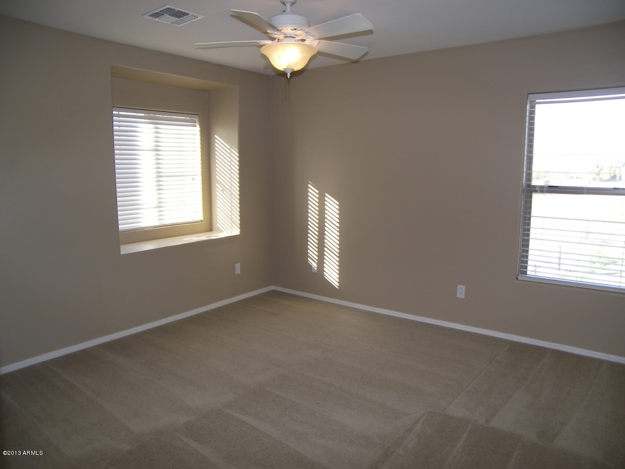 146 East Catclaw Street Gilbert, AZ 85296 - Photo 13 of 20 an empty room with a window