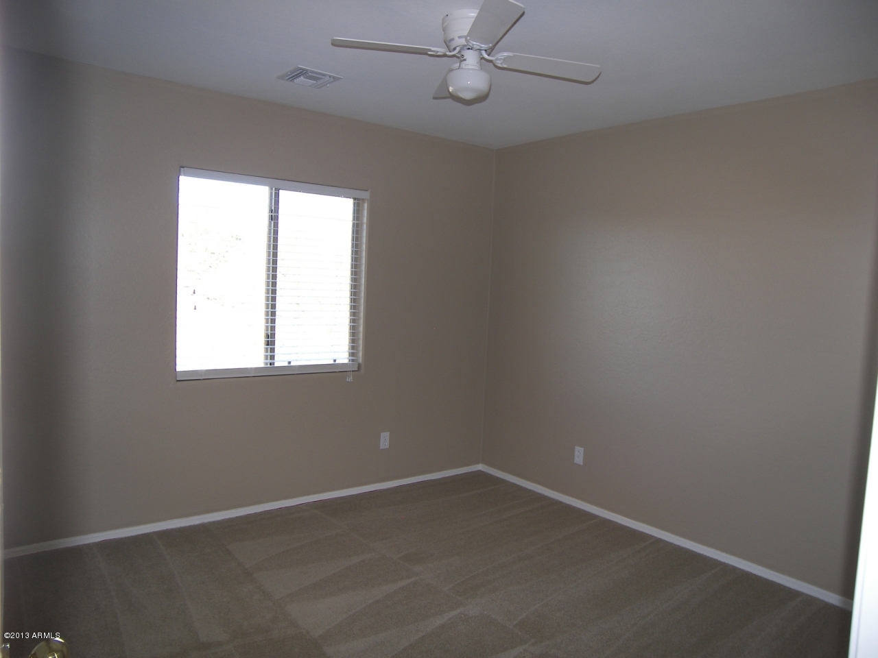 146 East Catclaw Street Gilbert, AZ 85296 - Photo 14 of 20 an empty room with a window