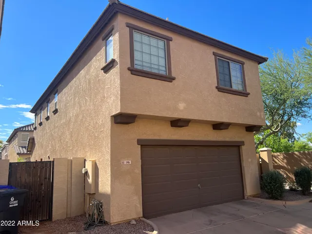 a front view of a house with garage