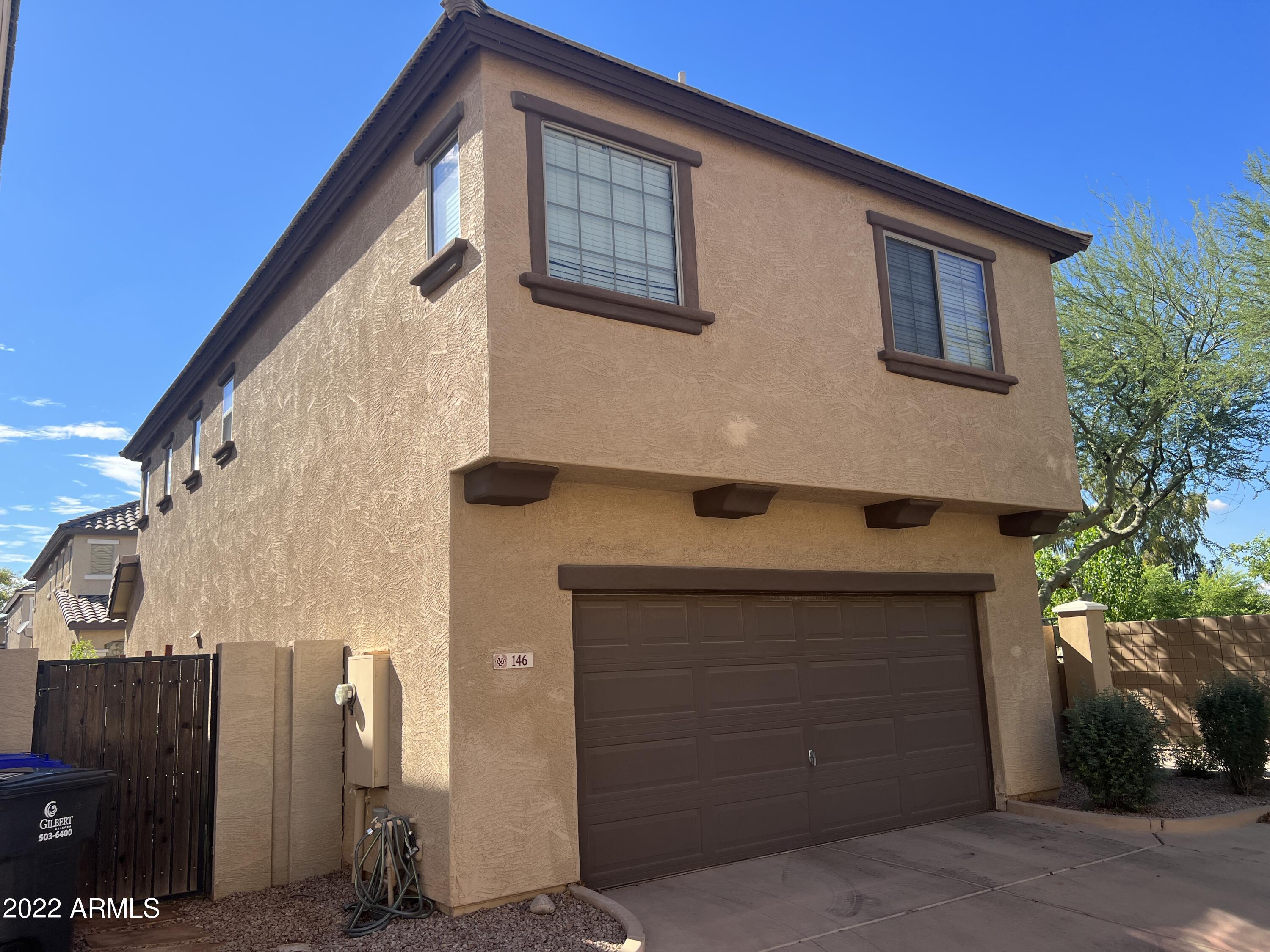 146 East Catclaw Street Gilbert, AZ 85296 - Photo 18 of 20 a front view of a house with garage
