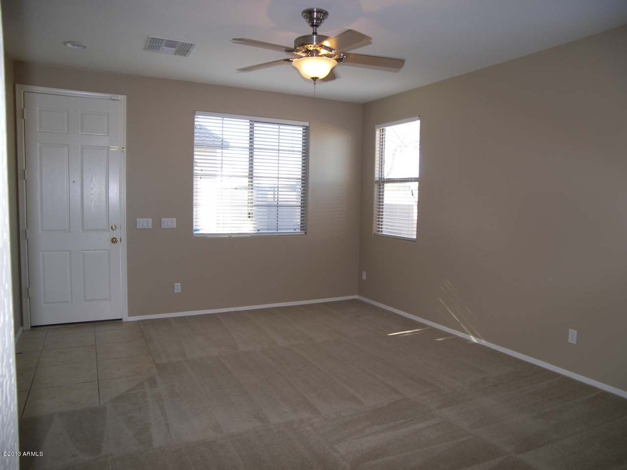 146 East Catclaw Street Gilbert, AZ 85296 - Photo 3 of 20 a view of an empty room with a window