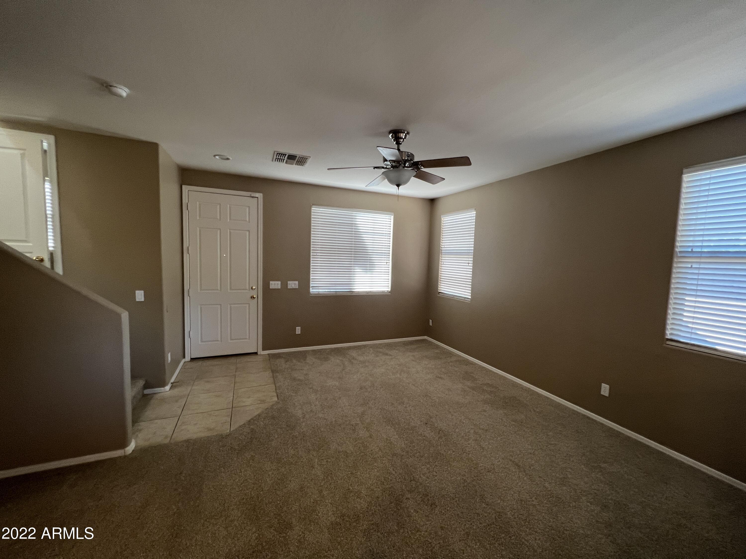 146 East Catclaw Street Gilbert, AZ 85296 - Photo 7 of 20 a view of an empty room with a window