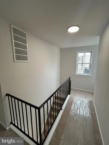 a view of hallway with windows
