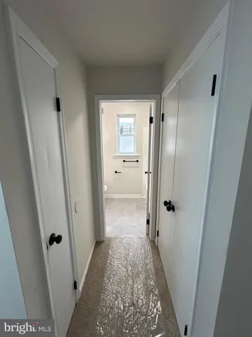 a bathroom with a granite countertop shower and a sink
