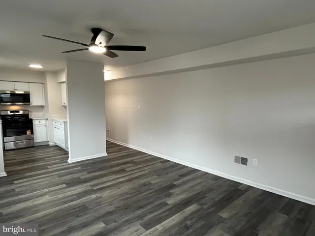 a view of a livingroom with wooden floor
