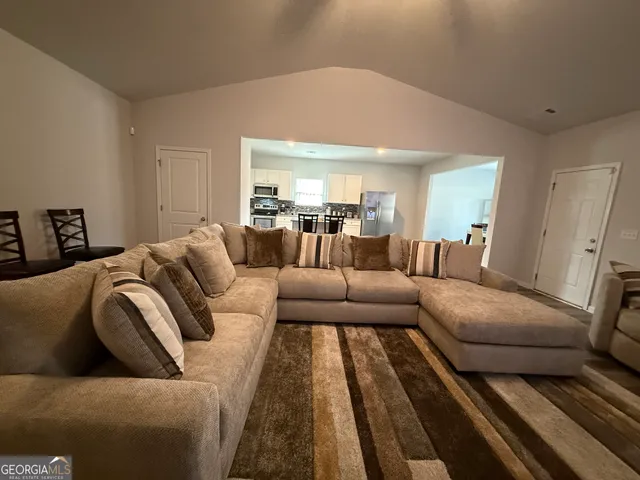 a living room with furniture and a couch