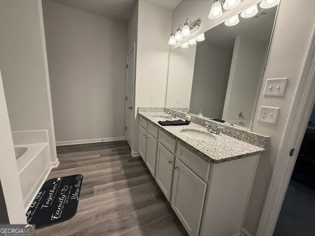 a kitchen with sink stove and refrigerator