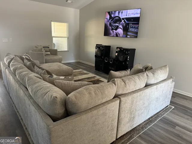 a living room with furniture and a couch