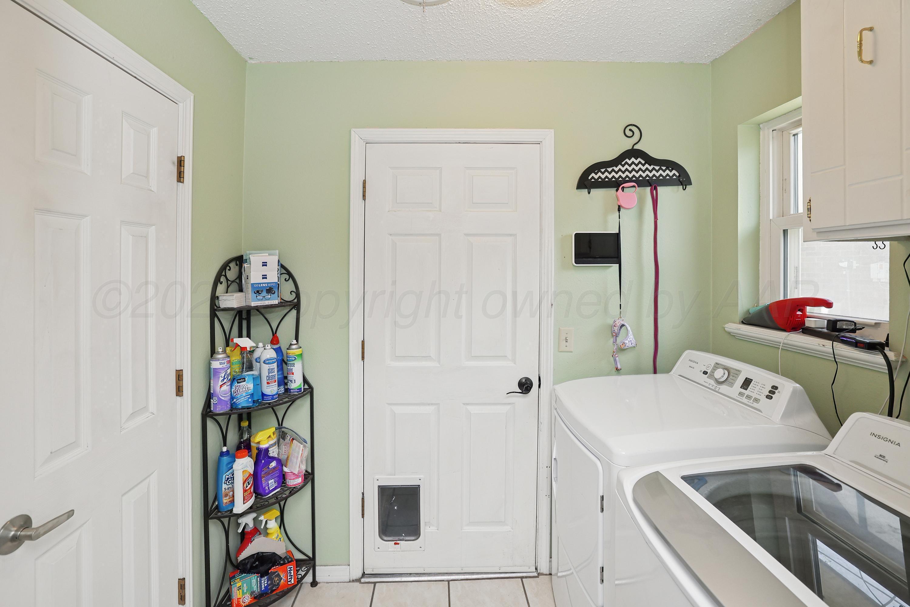 7903 Fenley Drive Amarillo, TX 79121 - Photo 16 of 20 a utility room with dryer and washer